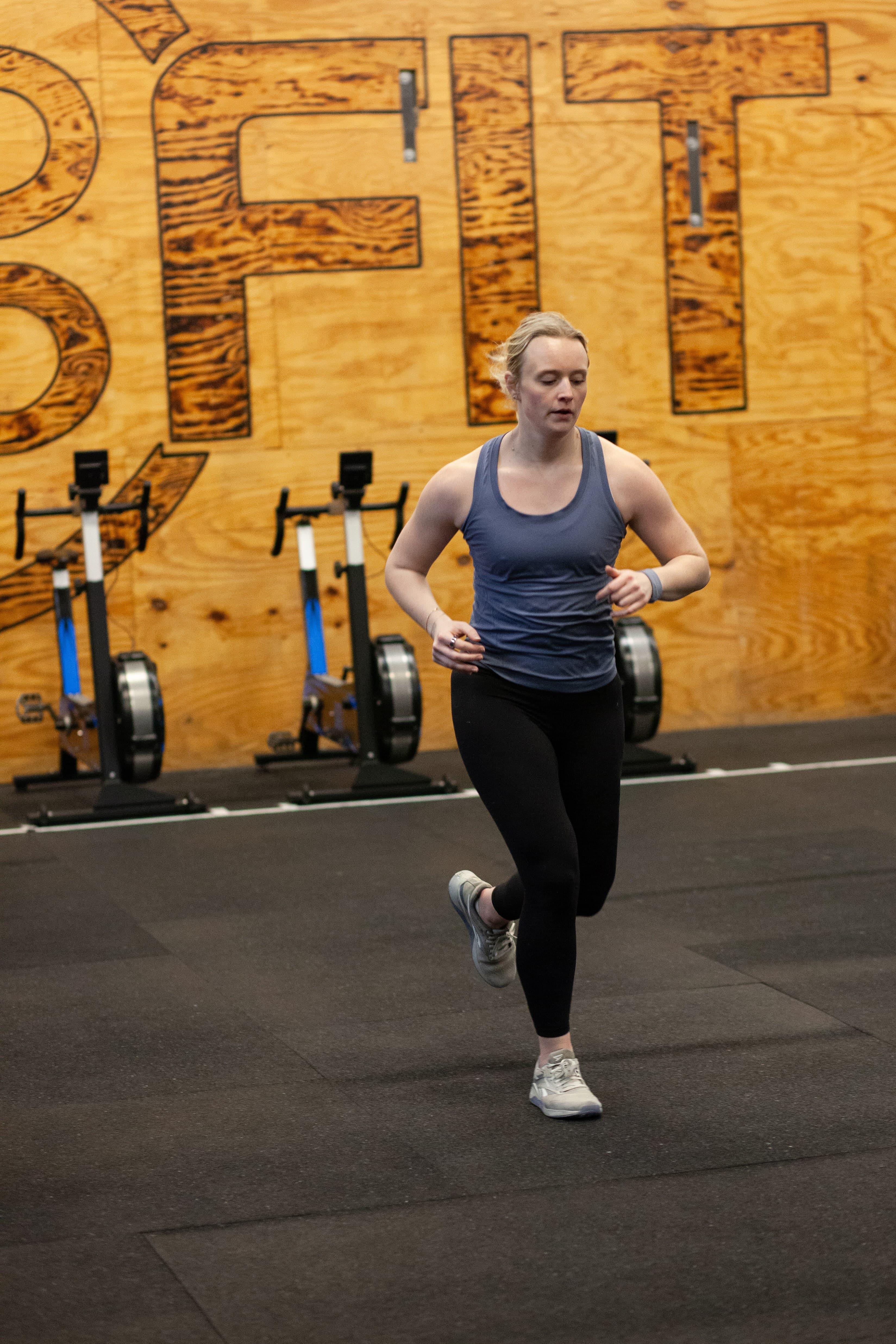 Member running with 2020FIT wall behind