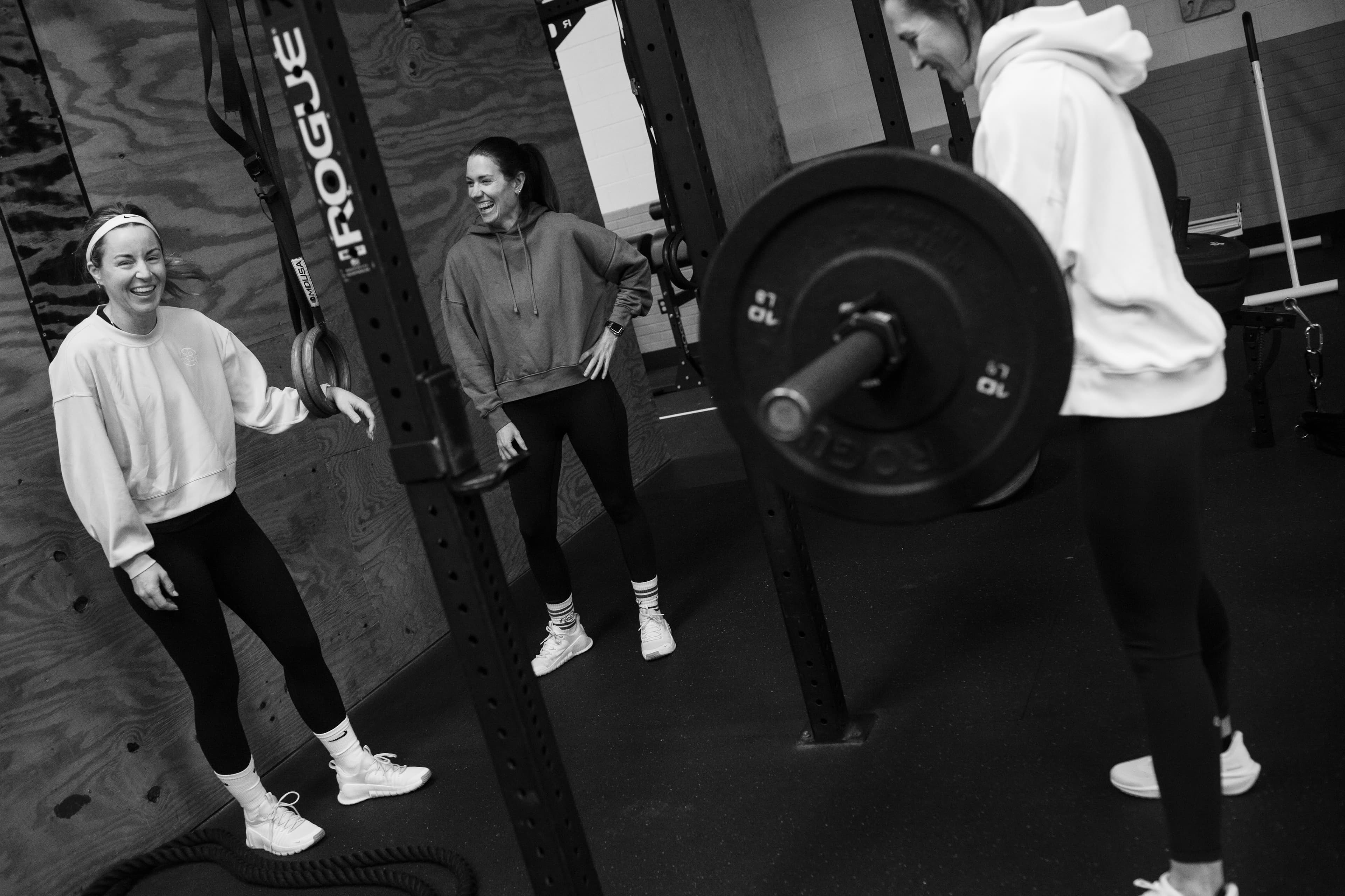 Member smiling during a deadlift
