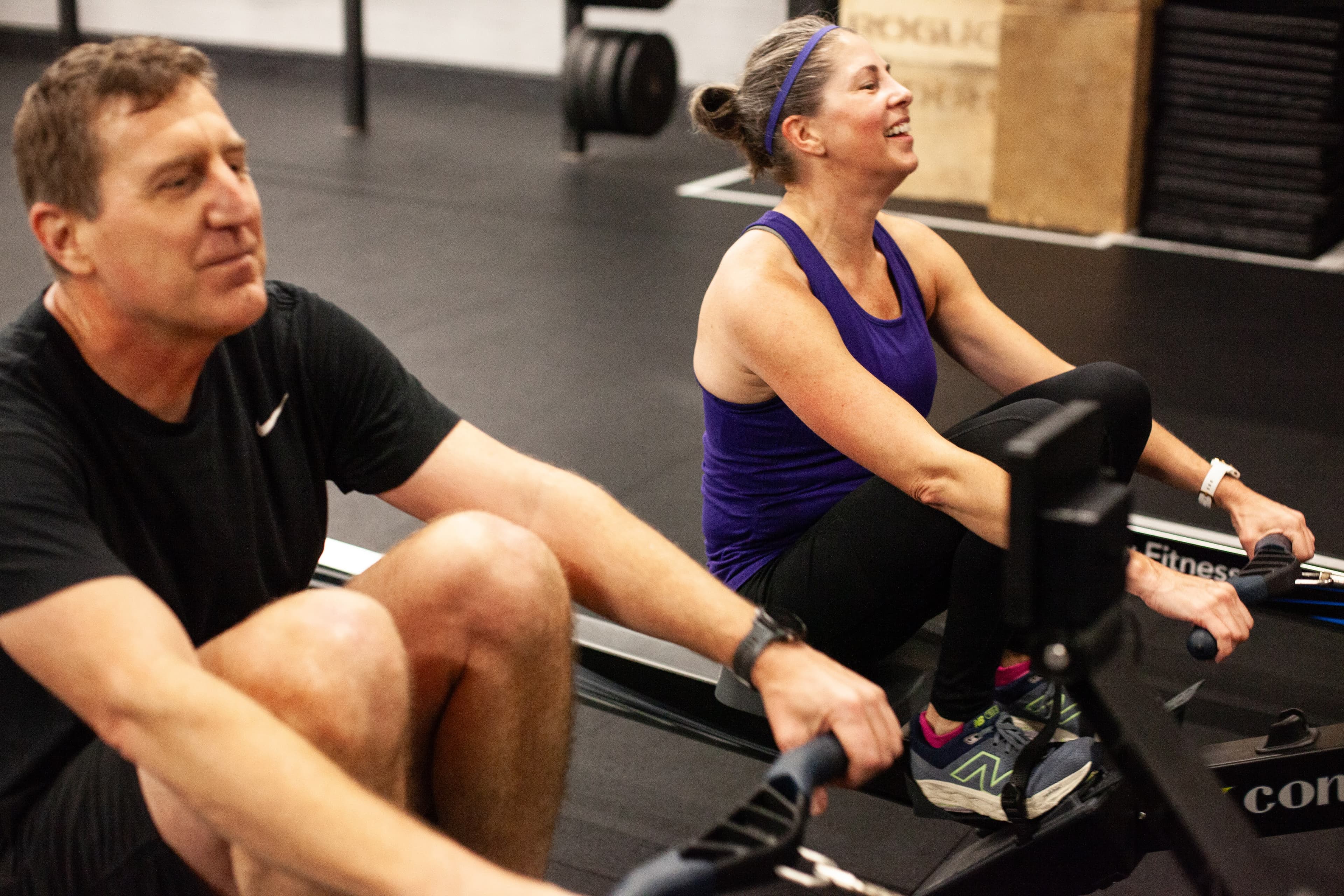 Members rowing together and laughing